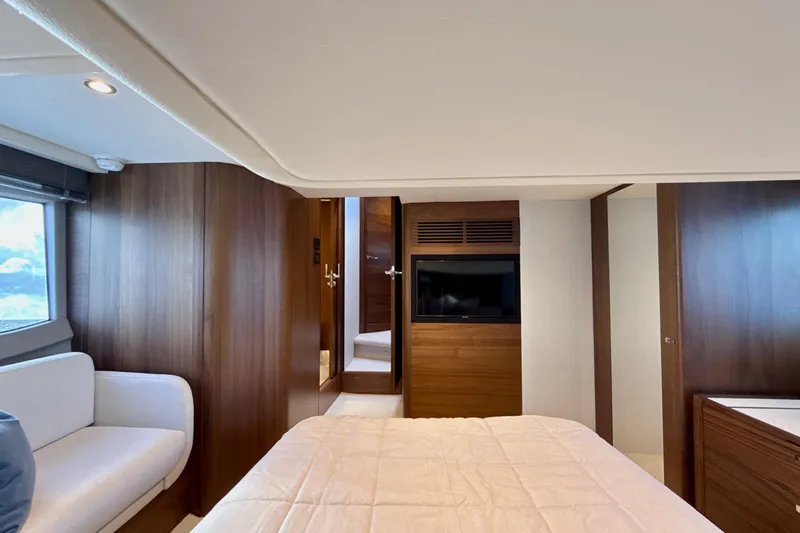  Yacht Photos Pics Luxurious interior of 2026 Princess F50 yacht with wood paneling and modern furnishings.