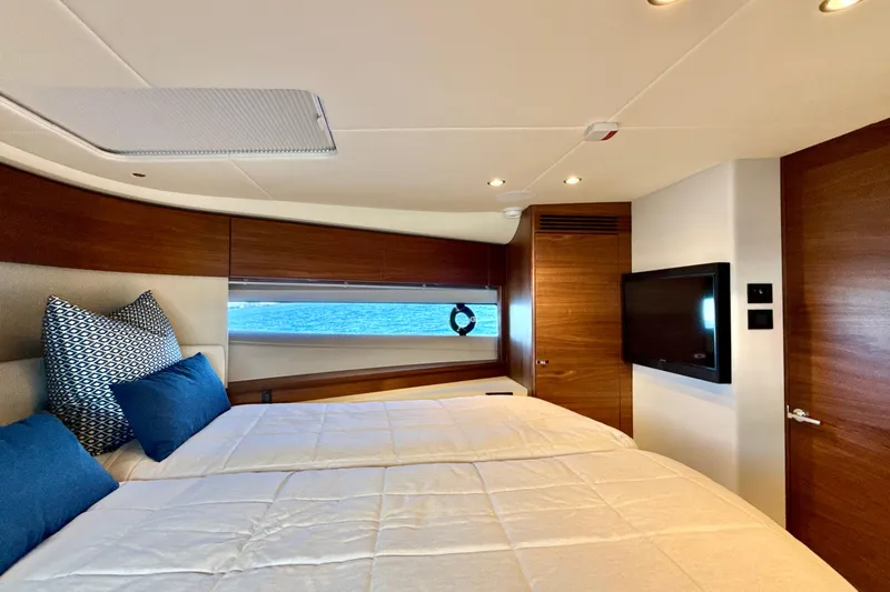  Yacht Photos Pics Luxurious cabin interior of 2026 Princess F50 yacht with elegant bedding and modern amenities.