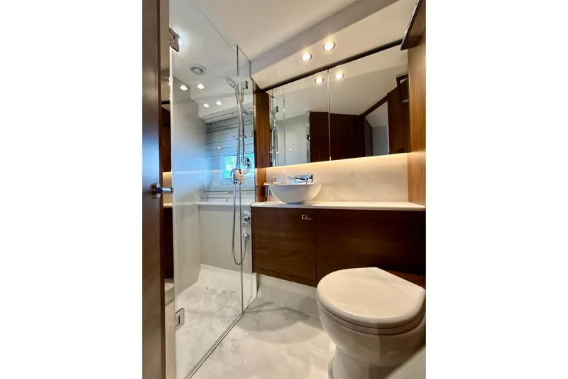  Yacht Photos Pics Luxurious bathroom in 2026 Princess F50 yacht with modern fixtures and elegant design.