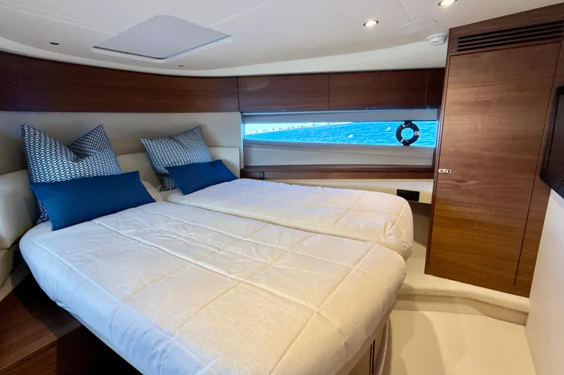  Yacht Photos Pics Luxurious cabin interior of 2026 Princess F50 yacht with twin beds and ocean view.