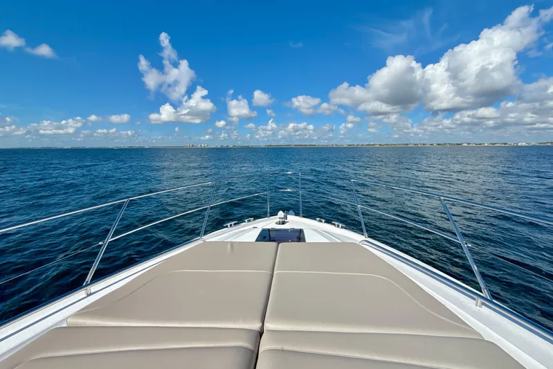  Yacht Photos Pics Bow view of 2026 Princess F50 yacht cruising on open sea under blue sky.