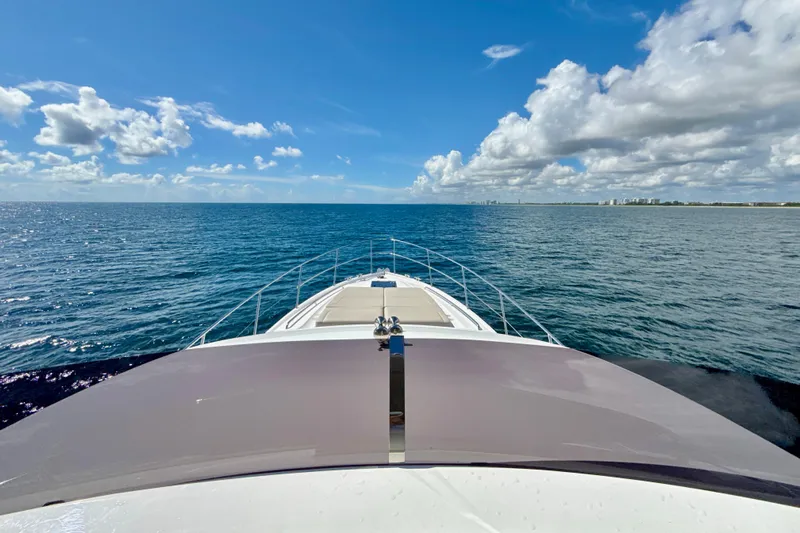  Yacht Photos Pics Bow view of 2026 Princess F50 yacht cruising on a sunny ocean.