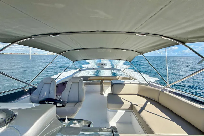  Yacht Photos Pics Luxurious 2026 Princess F50 yacht cruising on open water under a clear sky.