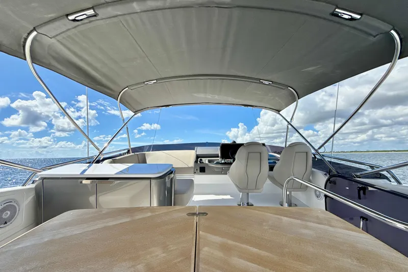  Yacht Photos Pics Luxurious 2026 Princess F50 yacht interior with helm, seating, and ocean view.
