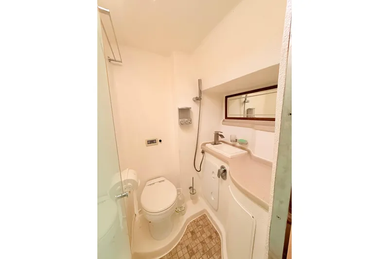 Orbit Yacht Photos Pics Bathroom interior of 2011 Royal Cape Catamarans Majestic 53 yacht, featuring shower and toilet.