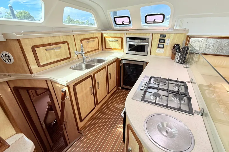 Orbit Yacht Photos Pics Luxurious kitchen interior of 2011 Royal Cape Catamarans Majestic 53 with modern appliances.