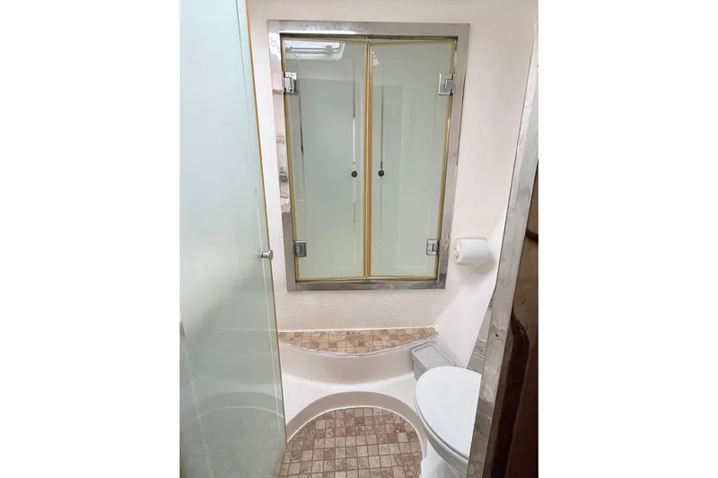 Orbit Yacht Photos Pics Bathroom interior of 2011 Royal Cape Catamarans Majestic 53 with shower and toilet.