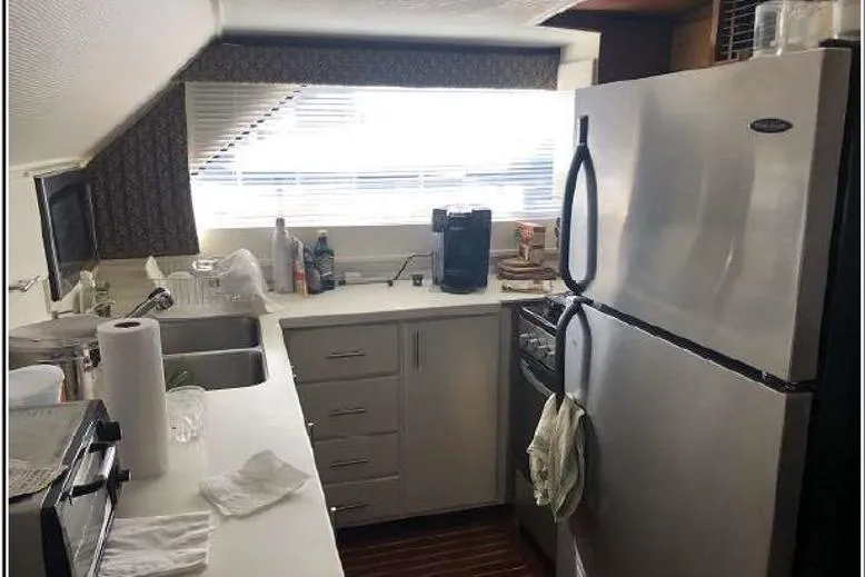 Top Coat Yacht Photos Pics 1974 Pacemaker Cockpit Motoryacht kitchen with modern appliances and ample counter space.