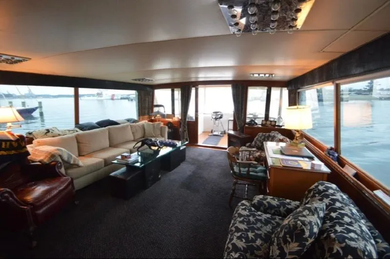 Top Coat Yacht Photos Pics Luxurious interior of a 1974 Pacemaker Cockpit Motoryacht with elegant seating and waterfront views.