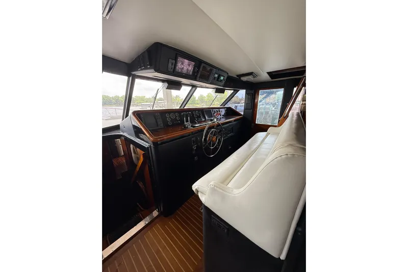 Top Coat Yacht Photos Pics 1974 Pacemaker Cockpit Motoryacht interior with steering wheel and control panel.