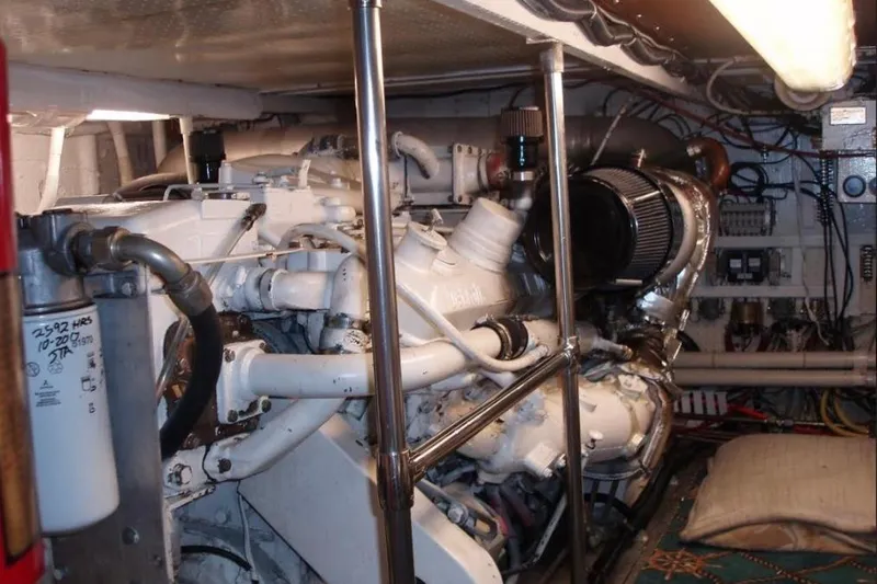 Top Coat Yacht Photos Pics Engine room of a 1974 Pacemaker Cockpit Motoryacht, showcasing mechanical components and wiring.