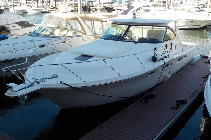 "lady Di" Yacht Photos Pics 2009 Tiara Yachts 3900 Open docked at marina, surrounded by other boats.