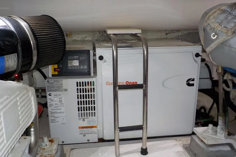 "lady Di" Yacht Photos Pics Engine room of 2009 Tiara Yachts 3900 Open with Cummins Onan generator.