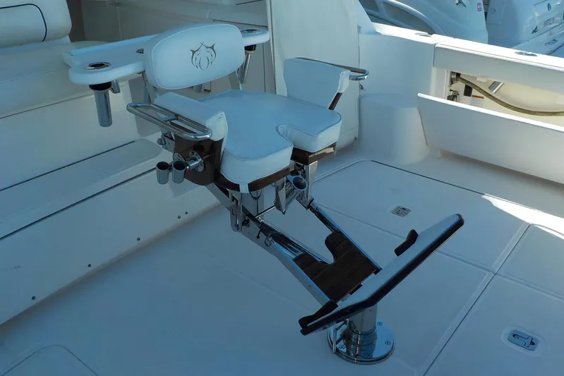 "lady Di" Yacht Photos Pics Luxury fishing chair on 2009 Tiara Yachts 3900 Open deck, featuring rod holders and footrest.