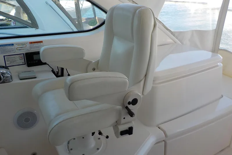 "lady Di" Yacht Photos Pics Captain's chair on 2009 Tiara Yachts 3900 Open, featuring white upholstery and control panel.