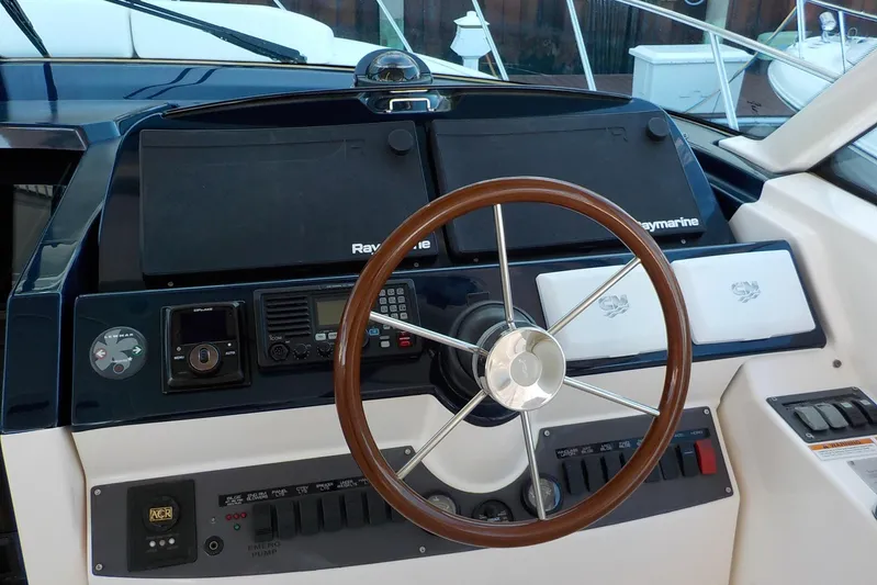 "lady Di" Yacht Photos Pics 2009 Tiara Yachts 3900 Open helm with Raymarine electronics and wooden steering wheel.