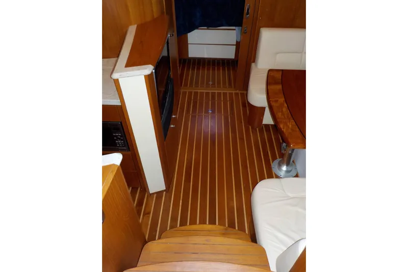 "lady Di" Yacht Photos Pics Interior of 2009 Tiara Yachts 3900 Open with wood flooring and seating area.