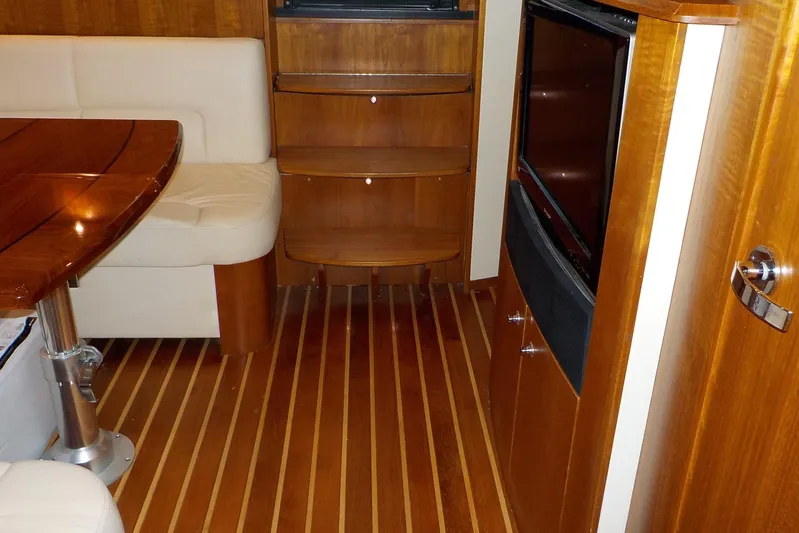 "lady Di" Yacht Photos Pics Interior of 2009 Tiara Yachts 3900 Open with wood flooring and seating area.