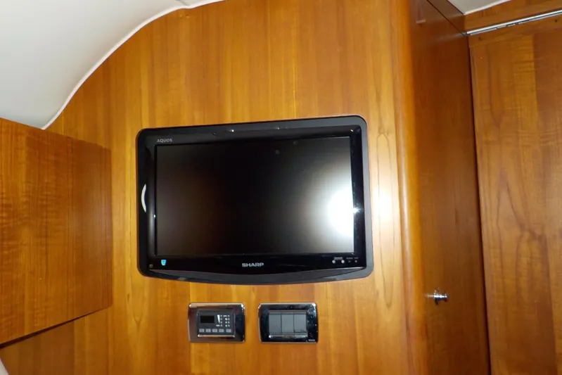 "lady Di" Yacht Photos Pics Wall-mounted Sharp TV in 2009 Tiara Yachts 3900 Open cabin interior.