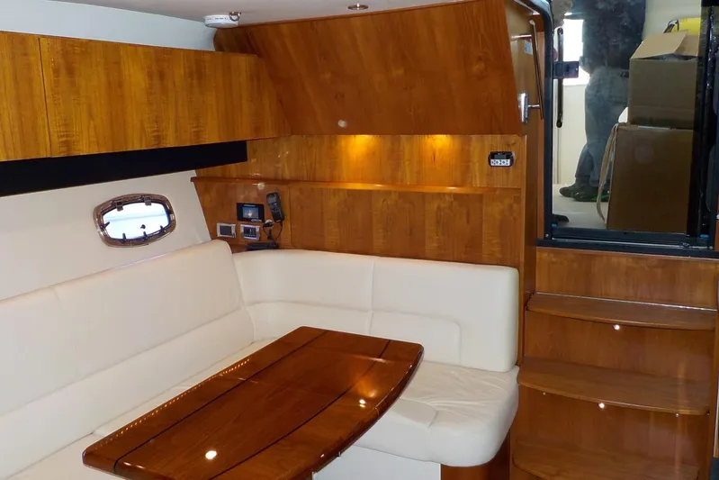 "lady Di" Yacht Photos Pics Luxurious interior of 2009 Tiara Yachts 3900 Open with wood finish and plush seating.