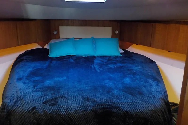 "lady Di" Yacht Photos Pics Luxurious cabin interior of 2009 Tiara Yachts 3900 Open with cozy bedding.