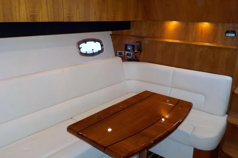 "lady Di" Yacht Photos Pics Luxurious interior of 2009 Tiara Yachts 3900 Open with elegant wood and leather seating.