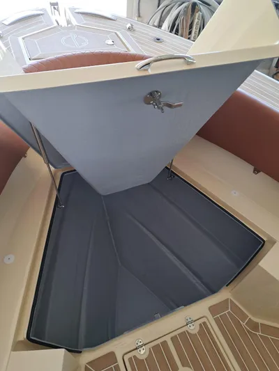 Yacht Photos Pics 2025 Lilybaeum Levanzo 25 Lounge Deck interior storage compartment with open hatch and key lock.