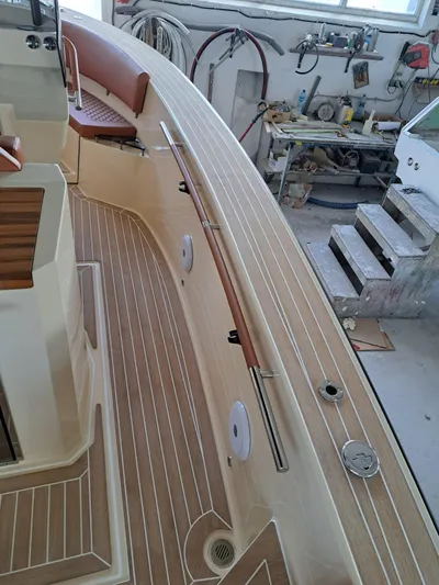  Yacht Photos Pics 2025 Lilybaeum Levanzo 25 Lounge Deck boat interior with wood finish and seating.