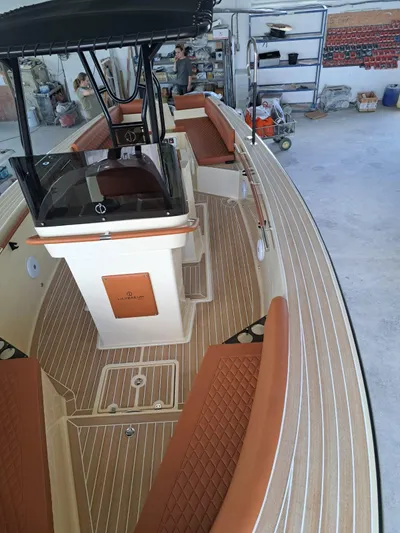  Yacht Photos Pics 2025 Lilybaeum Levanzo 25 Lounge Deck boat with elegant wood finish and cushioned seating.