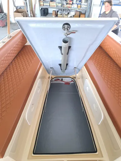  Yacht Photos Pics 2025 Lilybaeum Levanzo 25 Lounge Deck interior with open storage compartment and quilted seating.