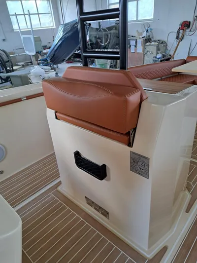  Yacht Photos Pics 2025 Lilybaeum Levanzo 25 Lounge Deck interior with brown leather seating and modern design.