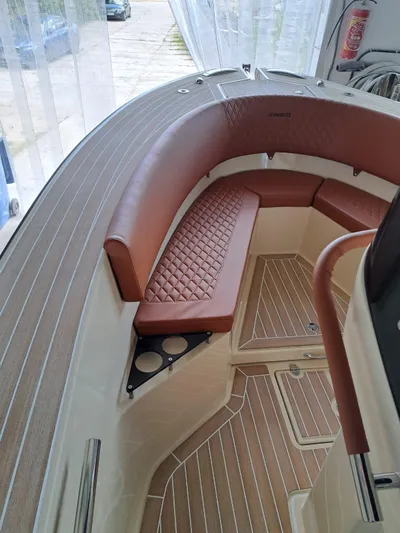  Yacht Photos Pics Luxurious interior of 2025 Lilybaeum Levanzo 25 Lounge Deck with elegant seating and wood finish.
