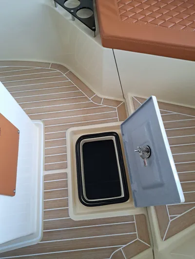  Yacht Photos Pics 2025 Lilybaeum Levanzo 25 Lounge Deck with open storage compartment and cushioned seating.