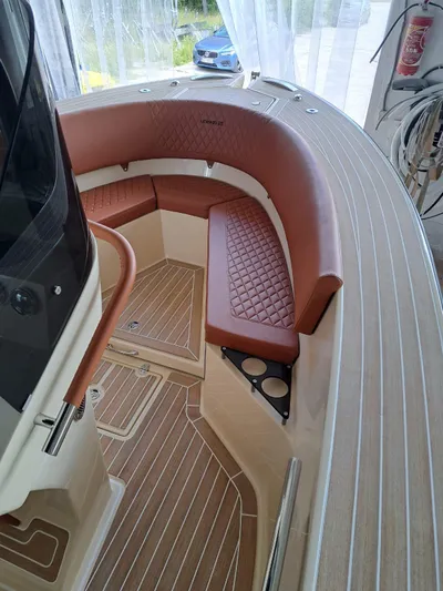  Yacht Photos Pics Luxurious interior of 2025 Lilybaeum Levanzo 25 Lounge Deck boat with elegant seating.
