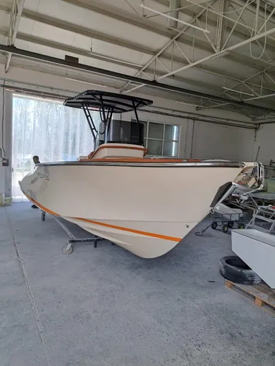  Yacht Photos Pics 2025 Lilybaeum Levanzo 25 Lounge Deck boat in a warehouse setting.