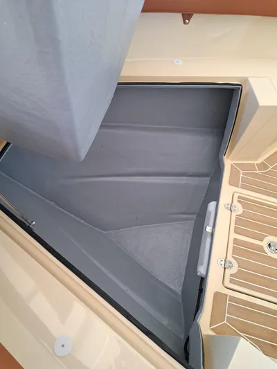  Yacht Photos Pics Storage compartment on Lilybaeum Levanzo 25 Lounge Deck, 2025 model, with wooden deck detail.