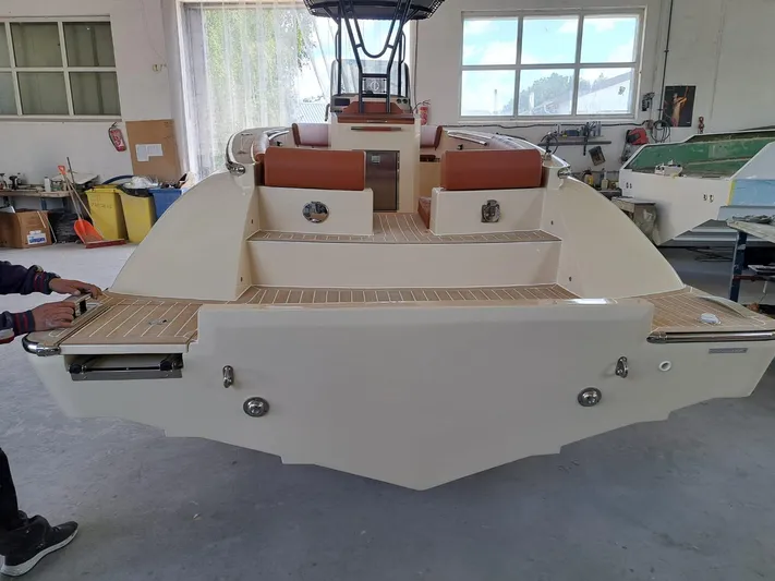  Yacht Photos Pics 2025 Lilybaeum Levanzo 25 Lounge Deck boat in a workshop setting.