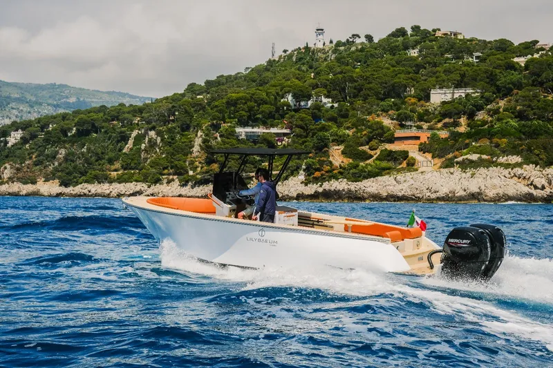  Yacht Photos Pics 2025 Lilybaeum Levanzo 25 Lounge Deck boat cruising near scenic coastline.