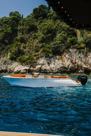  Yacht Photos Pics Lilybaeum Levanzo 25 Lounge Deck boat cruising near rocky coastline, 2025 model.