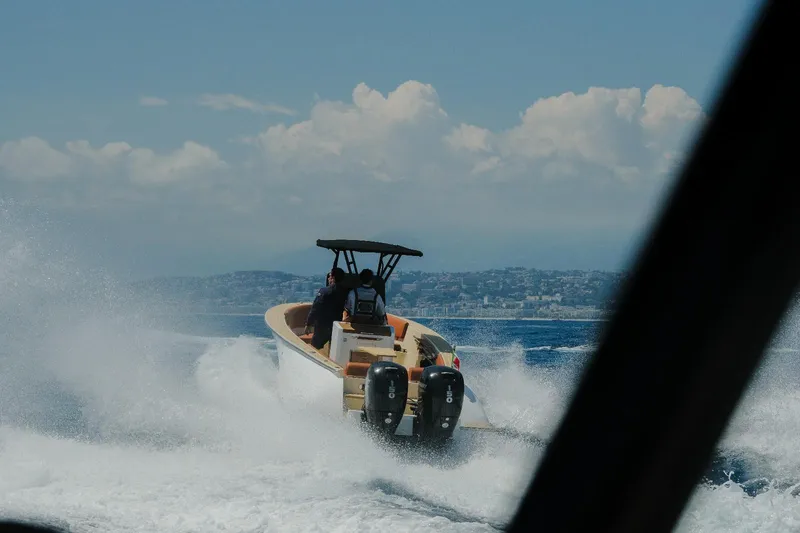  Yacht Photos Pics 2025 Lilybaeum Levanzo 25 Lounge Deck boat cruising on open water, creating waves.