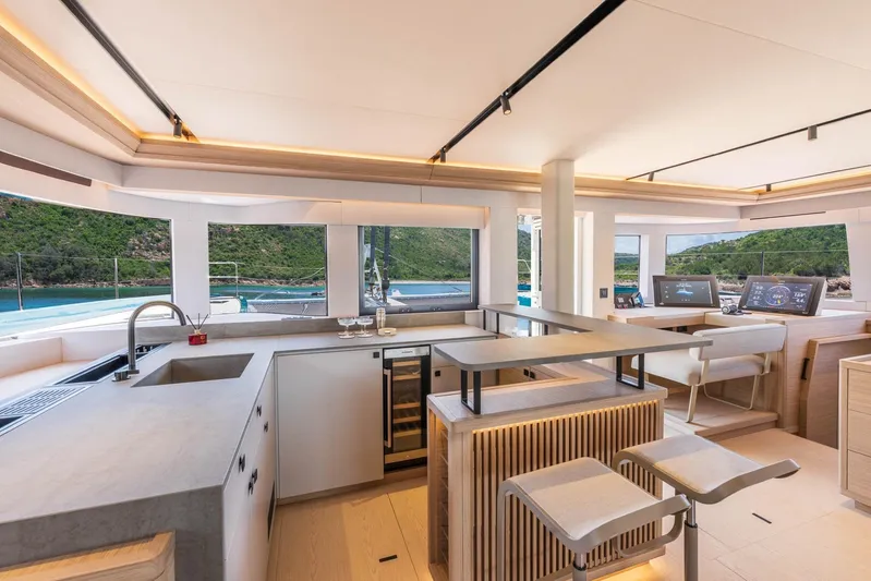  Yacht Photos Pics Manufacturer Provided Image: Luxurious interior of 2026 Lagoon Eighty 2 yacht with modern kitchen and scenic views.