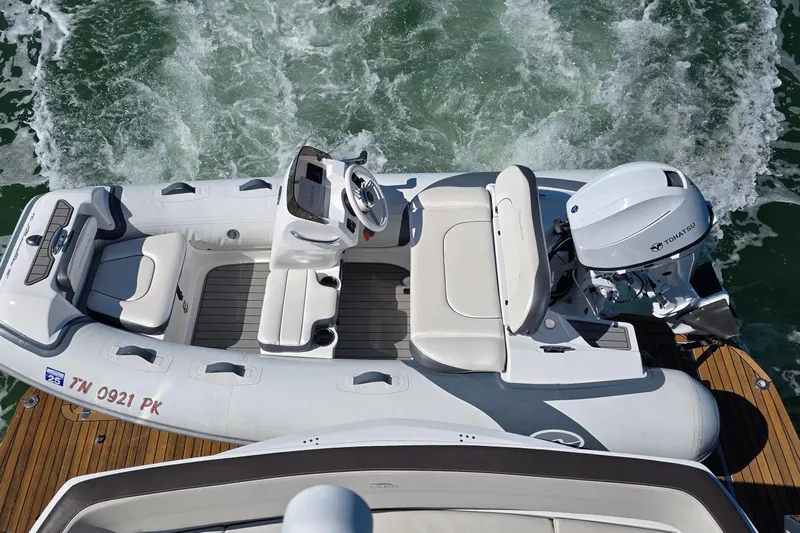 Benellie II Yacht Photos Pics 2022 Galeon 500 Fly yacht with Tohatsu outboard motor on water.