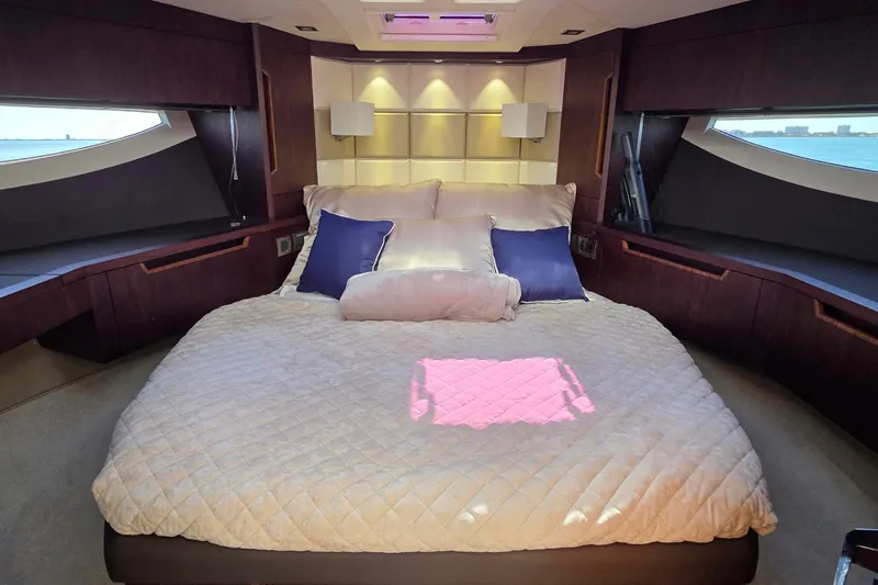 Benellie II Yacht Photos Pics Luxurious bedroom interior of 2022 Galeon 500 Fly yacht with elegant bedding and ocean view.