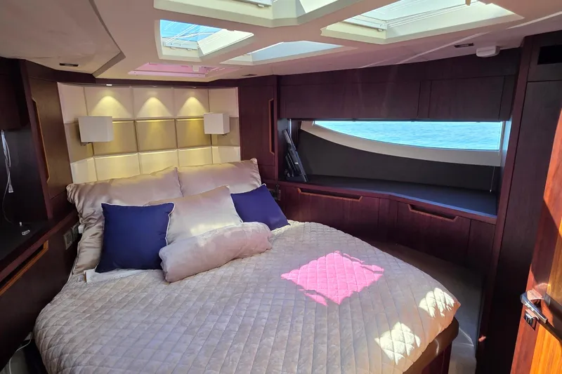 Benellie II Yacht Photos Pics Luxurious bedroom interior of 2022 Galeon 500 Fly yacht with ocean view.