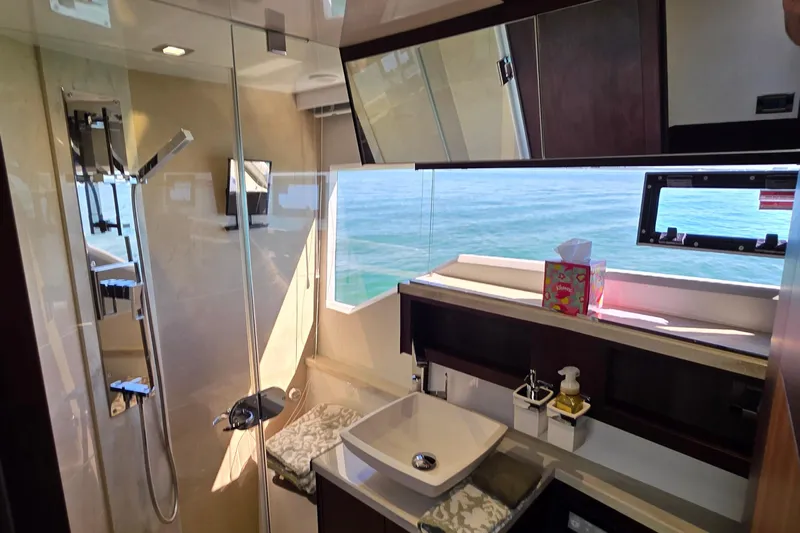 Benellie II Yacht Photos Pics Luxurious bathroom in 2022 Galeon 500 Fly yacht with ocean view and modern amenities.