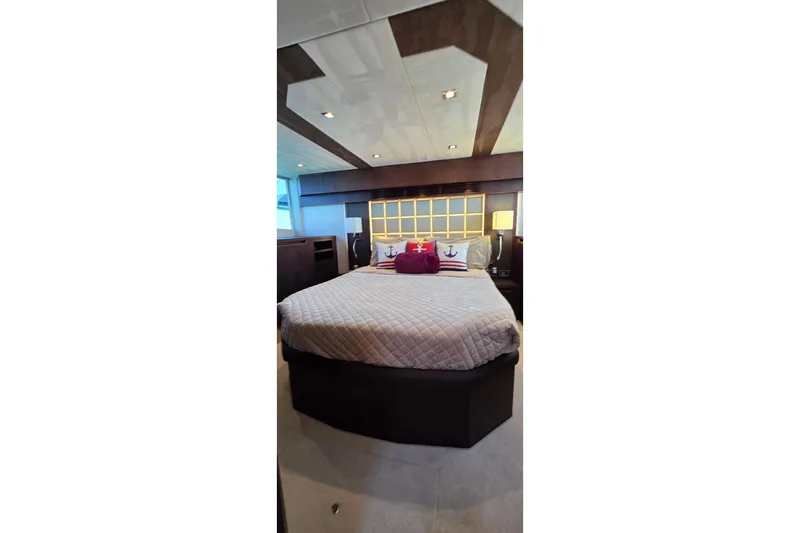 Benellie II Yacht Photos Pics Luxurious bedroom interior of 2022 Galeon 500 Fly yacht with elegant bedding.