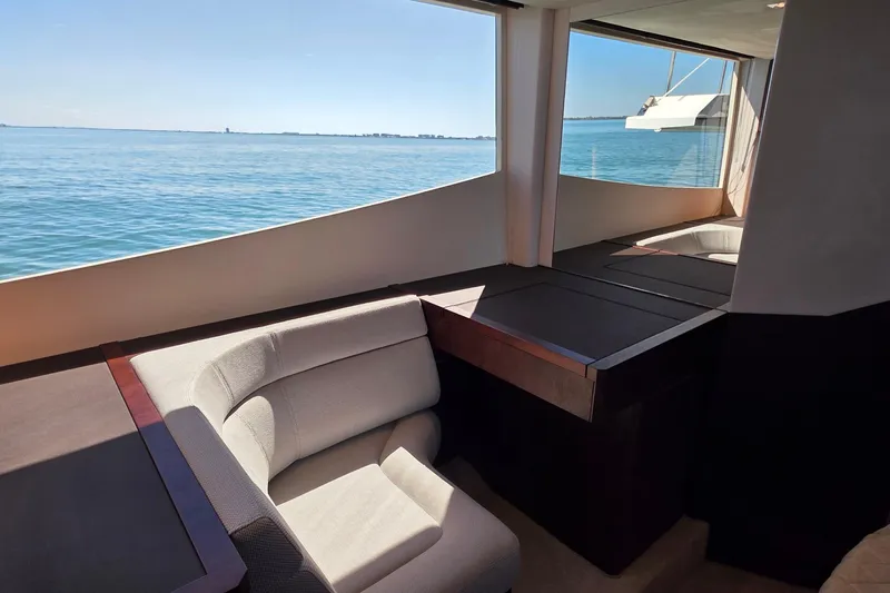 Benellie II Yacht Photos Pics Interior view of 2022 Galeon 500 Fly yacht with ocean backdrop.