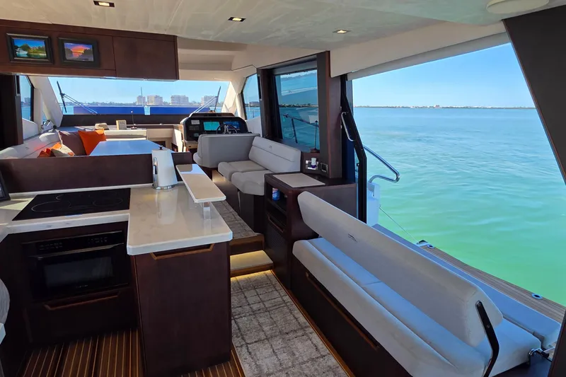 Benellie II Yacht Photos Pics Luxurious interior of 2022 Galeon 500 Fly yacht with modern kitchen and scenic ocean view.