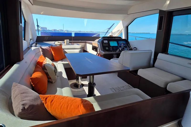 Benellie II Yacht Photos Pics Luxurious interior of 2022 Galeon 500 Fly yacht with plush seating and ocean view.