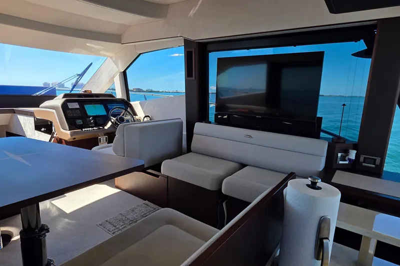 Benellie II Yacht Photos Pics Luxurious interior of 2022 Galeon 500 Fly yacht with helm, seating, and ocean view.
